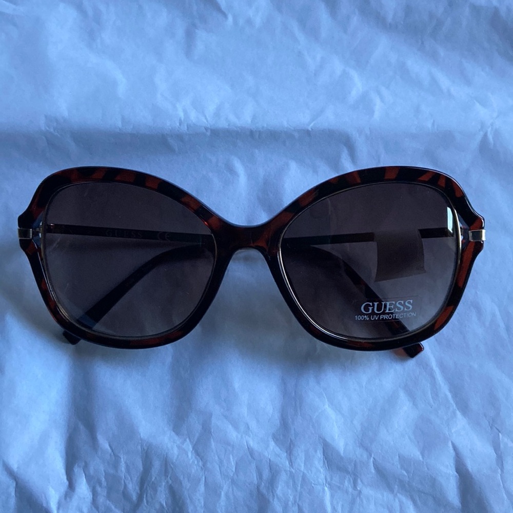 Brand new Guess Sunglasses!!   Cute, sexy and should be accessorizing you!